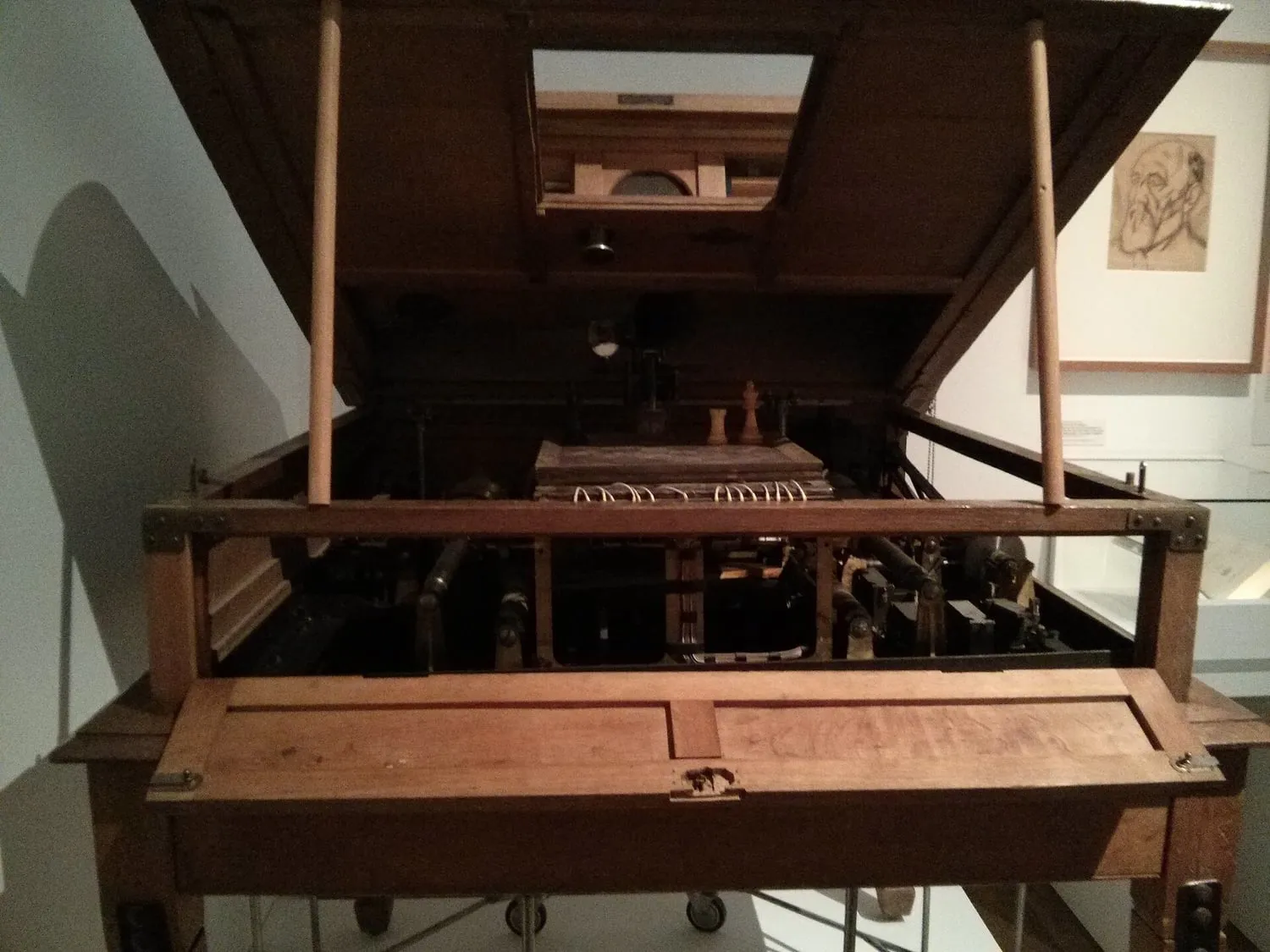Leonardo Torres Quevedo's El Ajedrecista chess automaton, a wooden mechanism over a small chessboard